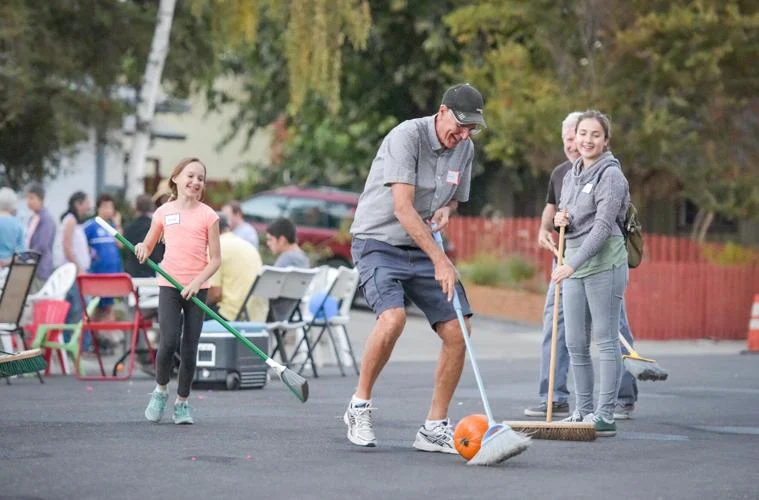 Image of Davis community members playing on the streets