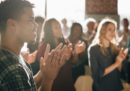 Diverse people clapping after a session