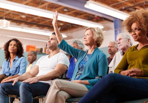 Woman holding her hand up