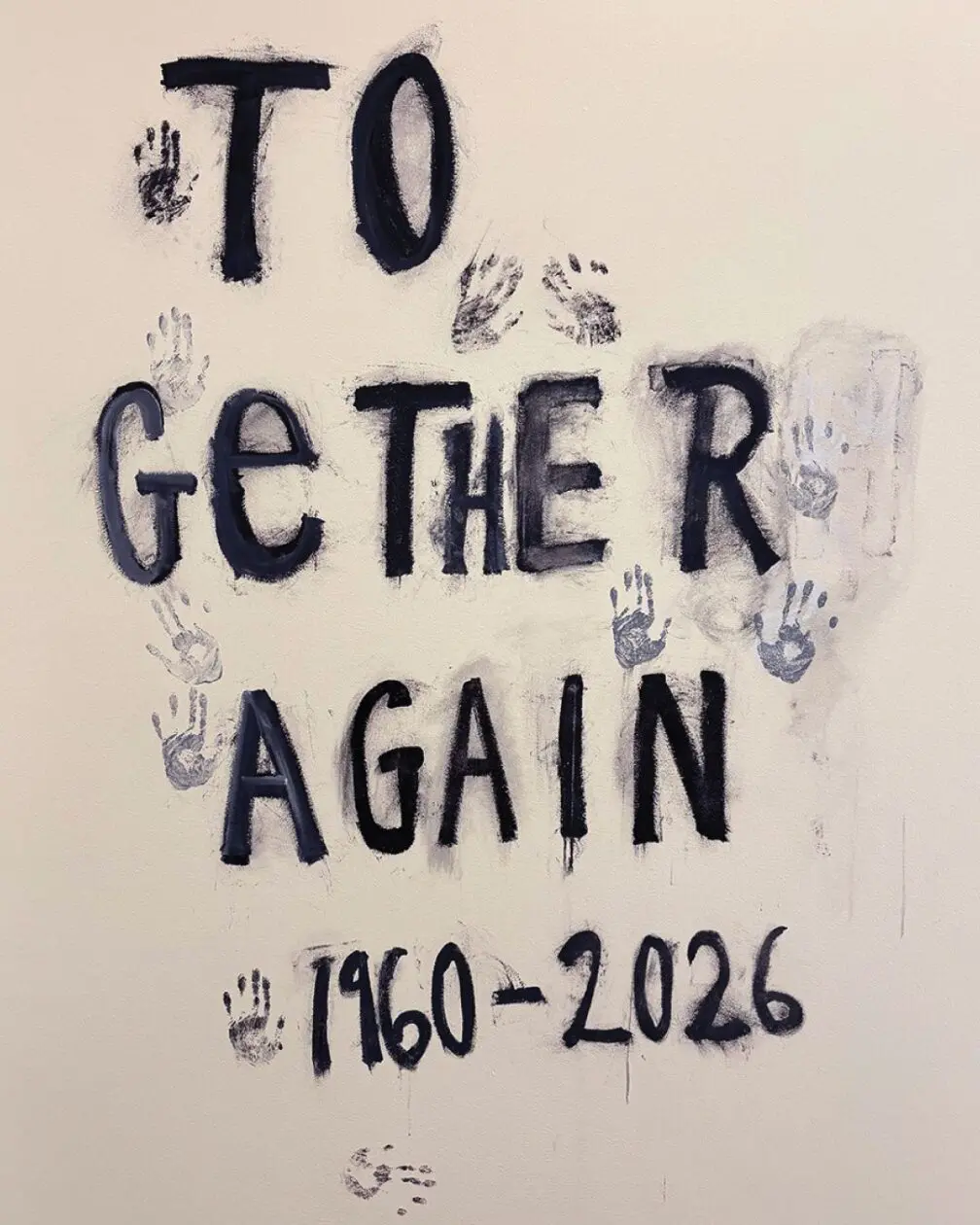 Black lettering on a cream-colored wall reads ‘TOGETHER AGAIN, 1960–2026,’ surrounded by painted handprints and smudges. Promotional image for the Together Again exhibition at the Manetti Shrem Museum.